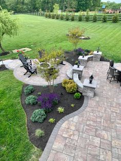 an outdoor patio with seating and landscaping