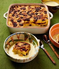 a casserole dish with fruit on it next to other dishes