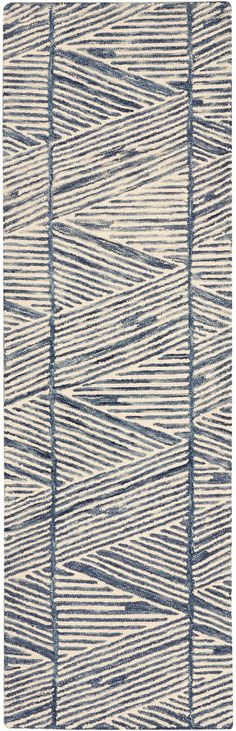 a blue and white rug with lines on it