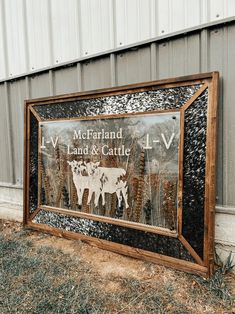 a sign for mcfarland land and cattle in front of a building