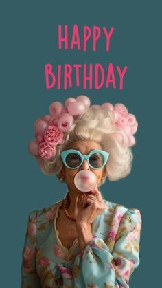 an old woman blowing bubbles with her face covered in pink flowers and the words happy birthday