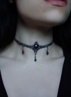 This one of a kind choker features a deep purple faceted amethyst in sterling silver wire, finished with your choice length of sterling silver chain for ease of adjustment. design © Dream Residue Jewelry Each order arrives packaged with a list of healing properties and jewelry care info. I always update my instagram first, follow me to shop my story sales for exclusive items: @DreamResidueJewery If you have any questions at all, or would like more photos or a video- please message me before purchasing. Custom orders are available! Choose your crystal or send me your own special crystal/item, discuss design, pick your wire, and choose your budget. Message me for more info or to start yours. Accessories For Dresses Jewelry, Night Court Jewelry, Wire Wrapped Choker, Goth Wedding Jewelry, Goth Choker Necklaces, Victorian Gothic Jewelry, Purple Choker, Vampire Jewelry, Gothic Jewellery