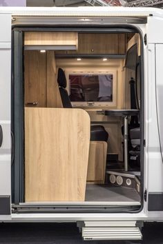 the interior of an rv with its door open