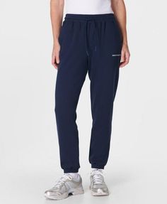 A relaxed new take on our elevated sweatpants. Made from a soft and breathable French terry cotton blend. Loose fit with sporty side panel stitching. Elasticated cuffs and a drawcord at the waist  . Two side pockets. Inseam length: 71.5cm /  28”. Model wears size S and is 178cm/5'10" tall. Style Code: SB9915Colour: Navy Blue Sporty Sweats With Drawstring For Loungewear, Sporty Drawstring Sweats For Loungewear, Athleisure Sweatpants With Tapered Leg And Elastic Panels, Athleisure Relaxed Fit Sweatpants With Elastic Panels, Sporty Sweatpants With Ribbed Waistband For Loungewear, Relaxed Cotton Joggers With Drawstring, Sporty Sweats With Elastic Cuffs And Relaxed Fit, Relaxed Fit Drawstring Sweatpants For Sportswear, Sporty Tapered Leg Joggers With Ribbed Waistband