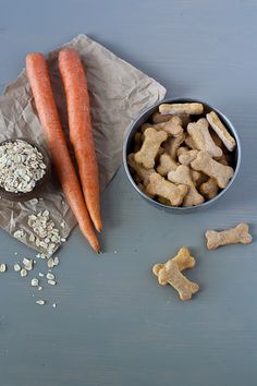 carrots, dog treats and oatmeal are on the table