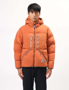 And wander and gramicci have collaborated to bring you the down jacket this time in orange a seriously cool winter-wear option.    its insulated design and water-resistant coating ensure protection against the elements while the reflective details keep you visible even after dark. it's warm yet lightweight making it an ideal winter jacket for any outdoor adventure.    article fit & features —    — material: 100% nylon shell  — down insulation  — handwarmer pockets  — zip closure chest pockets Functional Duck Down Outerwear For Streetwear, Casual Duck Down Hooded Jacket For Streetwear, Winter Puffer Jacket With Pockets For Hiking, Duck Down Puffer Jacket With Pockets For Outdoors, Duck Down Puffer Jacket With Pockets For Outdoor Activities, Sporty Duck Down Outerwear For Streetwear, Duck Down Outerwear With Pockets For Outdoor Activities, Duck Down Long Sleeve Outerwear For Hiking, Orange Outerwear With Pockets For Outdoor Activities