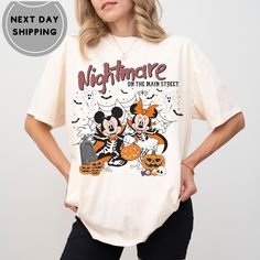 Disneyworld Nightmare On Main Street Sweatshirt, Disneyland Halloween Shirt, Halloween Mickey Minnie Pumpkin Sweater, Halloween Sweatshirt ABOUT US: -------------- ✔ Seeking personalized, comfy, and soft shirts? Express yourself with our T-shirts! With various colors, sizes, and unique designs, create a shirt that embodies you. Contact us for any queries; we'll respond promptly. HOW TO ORDER: ---------------------- ✔ To order, check the color, size, and description. Follow these steps: * Select Disney Halloween T-shirt Pre-shrunk, Disney Halloween Graphic Print T-shirt, Disney Halloween Fan Merchandise T-shirt, Disney Halloween T-shirt For Fan Events, Halloween Mickey Mouse T-shirt For Disney Fans, Disney Style Top For Fall Streetwear, Disney Tops For Streetwear In Fall, Disney Halloween T-shirt With Character Print, Disney Halloween Character Print T-shirt