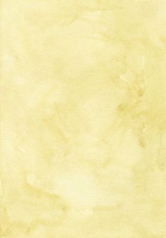 an old yellow paper textured with watercolor paint