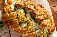 a cheesy bread dish with broccoli and cheese