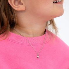 Radiating with grace and elegance, this cross-shaped pendant is a dazzling necklace for little girls and preteens. Encrusted with sparkling cubic zirconia stones, it shimmers with an enchanting brilliance. The hypoallergenic 925 sterling silver ensures a comfortable and safe experience for sensitive skin. A captivating symbol of grace, it carries the power to uplift and inspire, making it a cherished treasure for the wearer, a precious reminder of the divine presence that guides their journey. G Teen Necklaces, Kids Necklace, Necklace Sizes, Girls Shopping, Chain Lengths, Sterling Silver Necklaces, Sterling Silver Pendants, Silver Pendant, Silver Necklace