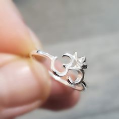 925 Sterling Silver Om Ring Metal:925 Sterling Silver Om Size: 8m >Nickel Free >No Allergic reaction >30 days return policy ++Items come in a gift box ready to be gifted Please contact me if you have any questions about the jewelry you are interested in buying. My Shop: https://www.etsy.com/shop/banujewelryusa Follow BANU Jewelry on Facebook, Instagram and other social media sites to keep up to date with newest products. www.instagram.com/shopbanujewelry www.facebook.com/shopbanujewelry Spiritual Midi Rings As Gift, Symbolic Nickel-free Ring For Gift, Nickel-free Symbolic Ring For Gift, Nickel-free Spiritual Ring For Gift, Nickel Free Sterling Silver Rings For Gifts, Spiritual Stackable Midi Rings Gift, Adjustable Silver Spiritual Midi Rings, Spiritual Open Ring Jewelry Gift, Spiritual Open Ring Jewelry As Gift