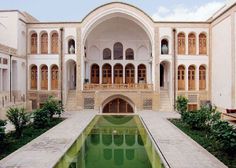 an indoor pool in the middle of a courtyard