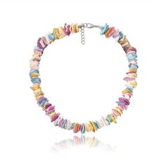 Strung on a 38 cm chain, this colorful piece is made up of different clam chip fragments painted with a mix of pastel colors. Each piece is set in either a lovely pink, ocean blue, golden yellow, or pearly white, or another beautiful pastel shade. Each piece is jaded and unique, making the entire necklace give off a natural appeal. This Innovato Design necklace ends with a stainless steel lobster claw clasp and a 7 cm extender link chain. The extender chain allows the wearer to adjust the length of the necklace.  Product Highlights    Made from natural clam chips  Multicolor Pastel Design  Durable lock and clasp Pastel Design, Pink Ocean, Pastel Designs, Pastel Shades, Golden Yellow, Ocean Blue, Blue Ocean, Pastel Colors, Crochet Necklace