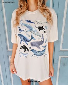 This Unisex garment-dyed t-shirt features a watercolor set of different whales, including a Narwhal, Humpbacks, and Orcas. It is the perfect gift for marine biologists, ocean conservationists, surfers and more! Make sure to check out the other garment options below :) » O P T I O N S « ‣ Hoodie: https://www.etsy.com/listing/1636311030 ‣ Crewneck: https://www.etsy.com/listing/1126253169 ‣ Youth Tee: https://www.etsy.com/listing/1518526240 » A B O U T « ‣ This item is made to order using direct-to Blue Casual Watercolor Print Top, Blue Casual Top With Watercolor Print, Casual Blue Watercolor Print Top, Casual White Fish Print Top, Blue Short Sleeve Tops With Watercolor Print, Blue Short Sleeve Top With Watercolor Print, Casual Cotton Tops With Watercolor Print, Casual White Tops With Watercolor Print, Casual White Top With Watercolor Print