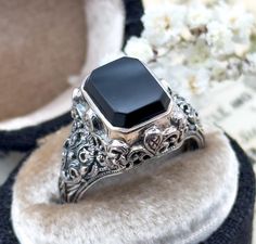 HOLIDAY SHIPPING UPDATE: Please reach out if you'd like me to add expedited shipping before you purchase and I can adjust prices as needed. Happy Holidays & Thank you for visiting us! -Lillian Here is a wonderful vintage onyx ring in sterling silver. This ring is vintage and was created in the art deco style to resemble a piece from the 1920s-30s. The filigree details surround a rectangular onyx centerpiece with beveled edges. The inside of the ring is stamped for silver. This effortlessly cool Vintage Onyx Ring, Onyx Signet Ring, Onyx Ring, Filigree Ring, Purple Glass, Art Deco Ring, True Vintage, Signet Ring, Art Deco Fashion