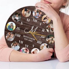 a woman holding a wooden clock with photos on it