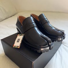 Sasaia Split Toe Loafer. Never Been Used / Worn. They Run Small, So Would Fit If You’re A 9 In Men. ( Maison Margiela Tabi Loafers ) Fitted Loafers With Rubber Sole And Flat Heel, Formal Leather Shoes With Pointed Toe And Vibram Sole, Black Loafers With Vibram Sole For Work, Modern Loafers With Round Toe Fit, Modern Fitted Loafers With Round Toe, Designer Round Toe Loafers For Spring, Leather Slip-on Shoes With Vibram Sole For Work, Fall Vibram Sole Slip-on Loafers, Designer Fitted Round Toe Loafers