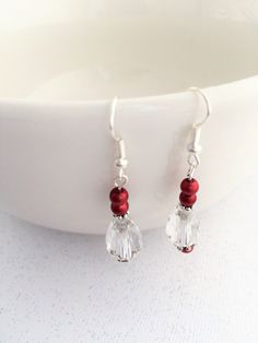 Red and clear crystal earrings, clear crystal, earrings, crystal earrings.   Guys are you looking for the perfect Valentine's gift for your girlfriend, but don't want to break the bank? These lovely handmade silver wire drop red bead and teardrop crystal earrings are the perfect solution. These lovely artisan handmade earrings come with a gift box with a nice bow tied on. Hurry, supplies are limited! Clear Crystal Earrings As A Gift, Clear Crystal Earrings For Gift, Clear Crystal Earrings, Earrings Crystal, Valentine's Gift, Gifts For Your Girlfriend, Dangly Earrings, Red Bead, Handmade Artisan