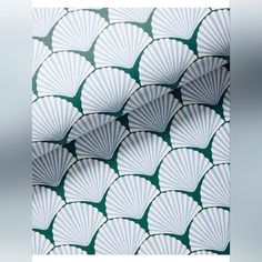 an image of white paper fans on green background