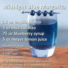 a blue liquid in a glass with instructions for how to make it and what to use it