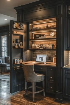 a laptop computer sitting on top of a desk next to a wooden shelf filled with shelves