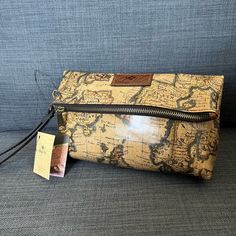 a map print purse with a tag on it