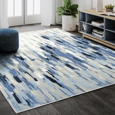 a blue and white rug in a living room