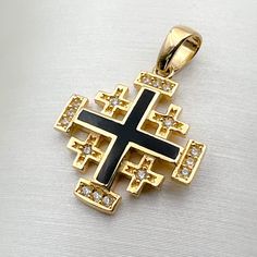 ✨ Introducing our Handmade 14k Gold Jerusalem Cross Pendant, a divine fusion of craftsmanship and symbolism. 🌟 Crafted in radiant yellow gold, this pendant showcases intricate details with Black Enamel and shimmering Cubic Zircons. Measuring 0.60x0.60 inches, it's a petite yet powerful expression of faith. 🌈 ✨ Immerse yourself in the profound religious significance of the Jerusalem Cross. Symbolizing the spread of God's word from Jerusalem to the four corners of the world, this pendant encapsu Black 14k Stamped Jewelry As Gift, Black 14k Stamped Jewelry For Gift, Traditional Black Jewelry With Polished Finish, Black Symbolic Cross Pendant Jewelry, Symbolic Black Cross Pendant Jewelry, Symbolic Black Gemstone Jewelry, Traditional Gold Jewelry With Black Enamel, Black Symbolic Jewelry For Anniversary, Black Symbolic Anniversary Jewelry