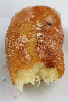 a close up of a pastry on a plate with powdered sugar sprinkled on it