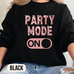 Turn the party vibes up with this "Party Mode On" T-Shirt or sweatshirt! Featuring a sparkling glitter graphic, (not real glitter) this cozy and oversized shirt is perfect for any celebration. Whether you're hosting or attending a party, this outfit will keep you comfortable and stylish all night long. ✨ 🎉 Glitter "Party Mode On" Design: Adds a fun and festive touch to your outfit. 👚 Cozy Oversized Fit: Soft and comfortable fabric, ideal for lounging or dancing. 🌟 Stylish : Trendy colors that Party Outfit Birthday, Birthday Party Outfit, Outfit Birthday, Party Mode, Birthday Party Outfits, Birthday Tshirts, On Design, Its My Birthday, Birthday Shirt