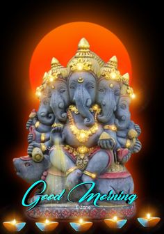 an elephant statue with lights around it and the words good morning written in front of it