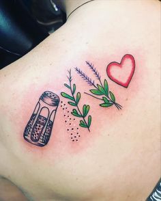 a tattoo with herbs and a heart on it