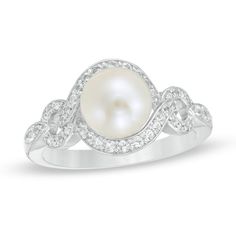 Grace her finger with this timeless pearl ring. Crafted in sterling silver, this classic choice showcases a lustrous 7.5-8.0mm cultured freshwater pearl centered in a cascading lab-created white sapphire-adorned frame. Additional created white sapphires line the ribbons of the open style shank. Buffed to a brilliant luster, this choice is a precious addition to her wardrobe. This ring is custom-made to fit your ring size. Sterling silver rings cannot be resized after purchase. Pearl Engagement Ring Set, Pearl Ring Design, Non Traditional Wedding Ring, Pearl Wedding Ring, Spain Trip, Pretty Engagement Rings, Frame Ring, Pearl Engagement Ring, Trip Outfits