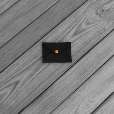 This card holder is made from 1000 denier black cordura with a light orange plastic snap closure. Use it for business cards, to present a gift card, or as a mini wallet.3.6" (9.1 cm) wide2.5" (6.4 cm) tallce053 Black Envelope Wallet For Daily Use, Modern Black Card Holder, Black Minimalist Card Holder For Gift, Minimalist Black Card Holder For Gift, Black Envelope Wallet As A Gift, Wallet Card, Mini Wallet, Card Envelopes, Light Orange