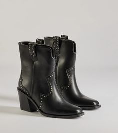 Level up the trendy vibes of your 'fits with these faux leather booties accented with a western stitched design and chic studded embellishments. They feature an above-the-ankle height with pull tabs, a square-shaped toe, an inner zipper closure for effortless styling, and a stacked block heel.Fit & FeaturesStacked block heelFaux leather materialWestern stitched design, studded embellishmentsAbove-the-ankle height, pull tabsSquare toeInner zipper closureRuns true to size Leather Booties, Stitch Design, Block Heels, Bootie Boots, Shoe Boots, Faux Leather, Boots, Heels, Leather