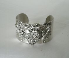 "This beautiful silver plated cuff bracelet has a silver plated art nouveau maiden and silver plated accents. 1.5\" wide." Antique Hand Cast Jewelry For Wedding, Antique Hand Cast Wedding Jewelry, Heart-shaped Sterling Silver Bracelet For Weddings, Sterling Silver Bracelet For Wedding On Valentine's Day, Ornate Silver Hand Cast Jewelry, Handmade Victorian Sterling Silver Bracelets, Handmade Victorian Sterling Silver Bracelet, Victorian Style Bangle As A Gift, Ornate Antique Silver Wedding Bracelets