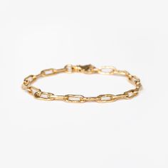 We are so excited to add a hammered textured chain to our bracelet collection!With longer links and a substantial lobster clasp, this solid 14k gold chain comes in three sizes so you can customize the fit perfectly to your wrist. It stacks beautifully with bangles and catches the light with a hammered texture. Timeless Chain Link Bracelet With Lobster Clasp, Classic Link Bracelets With Solid Link Construction, Formal Chain Link Bracelet With Hook And Links, Classic Link Chain Bracelet With Cable Chain, Modern Gold Chain Bracelet With Hook And Links, Timeless Link Chain Bracelet With Lobster Clasp, Classic Link Cable Chain Bracelet, Timeless Gold Chain Link Bracelet, 14k Gold Cable Chain Bracelet