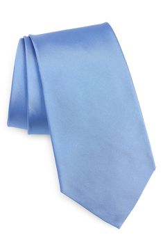 Solid coloring brings effortless versatility to a tie crafted from silk peau de soie to bring an understated finish to any formal or semiformal look. 58" length, 3 1/4" width 100% silk Dry clean Made in Italy Blue Silk Suit And Tie Accessories For Work, Blue Silk Tie For Workwear, Blue Silk Ties For Work, Formal Ties For Spring, Spring Formal Tie, Blue Silk Ties For Business, Classic Satin Tie With Satin Finish, Blue Silk Ties For Semi-formal Occasions, Fitted Blue Silk Suit And Tie Accessories