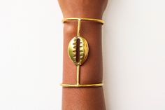 African brass bracelets, Cowrie bracelets, Brass jewelry, African cuff bracelet, Wrist Bracelet, Wrist bangle, Brass bangles, Christmas gift The bracelet is made using brass metal and cowrie shell. The bracelet is adjustable and can fit any wrist size. 3-5 Days delivery via DHL Express! *Pay shipping fee for first item and additional items ship for FREE* *Care instructions* Brass tarnishes with time due to oxidation. To clean kindly wipe it with lemon juice and a cloth. To view more items, kindly click here: nkoroicrafts.etsy.com Bone Decorations, Brass Cuff Bracelet, Women Bracelets, Bracelets Women, Bracelet Wrist, Wrist Bracelet, The Bangles, Brass Bangle, Brass Bracelet