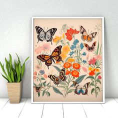 an art print of butterflies and flowers on a wall next to a potted plant