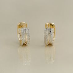 Gold(14K) : 6.52g  Diamonds : (VS clarity & H-I colour) : (Brilliant cut ) : 0.65ct Baguette Diamond : 0.25ct Baguette Diamond, Clip Earrings, Diamond Studs, Pave Diamonds, Precious Metals, Prong Setting, Clip On Earrings, Elegant Design, Diamond Earrings