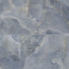 two pictures of marble with different colors and patterns on them, one is grey and the other is white