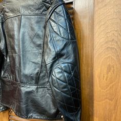 "Vintage 1960's Cafe Racer Leather Jacket. No Size Tag. Please check the measurements below. Very good condition. No label. Original 1960's. Leather cafe racer with quilted reign shoulder pads and elbow pads. All Sales Final. Please ask any questions before purchase. Take a look at our Store for more Vintage Clothing - VintageOnHollywood. MEASUREMENTS Shoulder to Shoulder: 19\" Underarm to Underarm: 21 1/2\" Outer Sleeve Length (shoulder edge to cuff edge): 26 1/4\" Top to Bottom Length (from co Vintage Winter Biker Jacket With Double-needle Stitching, Retro Fitted Leather Jacket, Fitted Long Sleeve Rockabilly Outerwear, Vintage Black Leather Jacket With Long Sleeves, Vintage Black Long Sleeve Leather Jacket, Vintage Black Outerwear For Biker Events, 60s Motorcycle, Racer Leather Jacket, Karen Robinson