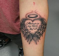 a tattoo with an angel and the words always in my heart on it's arm