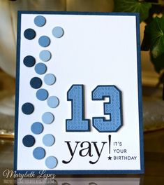 a birthday card with the number 13 on it's front and blue dots in the background