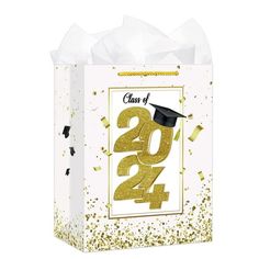 a graduation gift bag with gold confetti on it