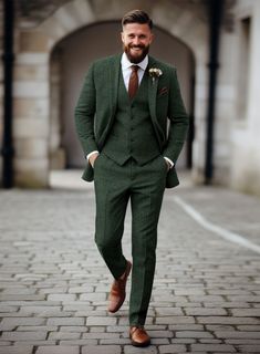 Discover the elegant Bottle Green Herringbone Tweed Suit at StudioSuits. Custom-tailored for a perfect fit, this green tweed suit offers a sophisticated herringbone pattern and luxurious wool fabric. Ideal for distinctive style and suave appearances. Dapper Wedding Suit, Green Vest Wedding Men, Grey And Green Suit Men, Khaki Green Suit, Green Grey Suit Wedding, Wedding Party Outfit Men, Groom In Dark Green, Forest Green Suits Wedding, Wedding Suits Tweed