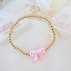 Gorgeous 14k Gold Plated 4mm Beaded Bracelet With A Pink Pearl Bow Bead Perfect Bracelet To Wear Alone Or Stacked With Other Favorite Pieces Bracelet Measures Approximately 7 Inches This Is For One Bracelet Only Tags: Preppy, Coquette, Pearls, Pink Bow, Spring Fashion, Gift For Her, Easter, Trend, Trendy, Love Shack Fancy, Stoney Clover Lane, Enewton, Mean Girls,, Bridgerton Couqutte Jewelry, Love Shack Fancy Jewelry, Summer Jewelry Stack, Cute Party Favors For Teens, Preppy Stuff To Get For Your Birthday, Fancy Beaded Bracelets, Easter Beaded Bracelets, Coquette Beaded Bracelet, Cute Bracelet Stacks