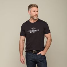 The Men's Lucchese Classic Embroidered Tee is a staple piece in our men's shirting collection. Under a vest or jacket, this embroidered tee is perfect for a day around the house or cheering on your team at the big game. Model is 6'1 and wearing size M. Handcrafted Boots, Handmade Boot, Embroidered Tee, Big Game, Staple Pieces, Mens Tees, Black Tee, The Man, The House