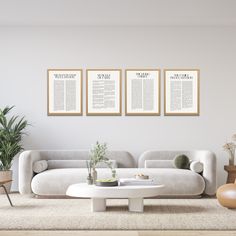 a living room with three posters on the wall and two chairs in front of it